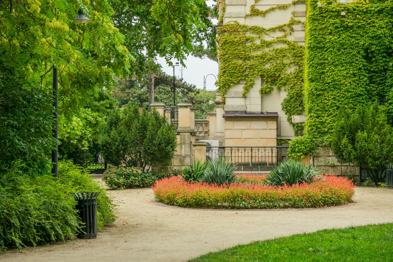 A well kept garden with a foot path and seasonal plants.